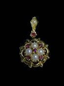 Pearl and ruby pendant set in 18 carat yellow gold.