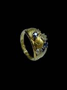 Sapphire and diamond six stone 18 carat gold ring, size P.