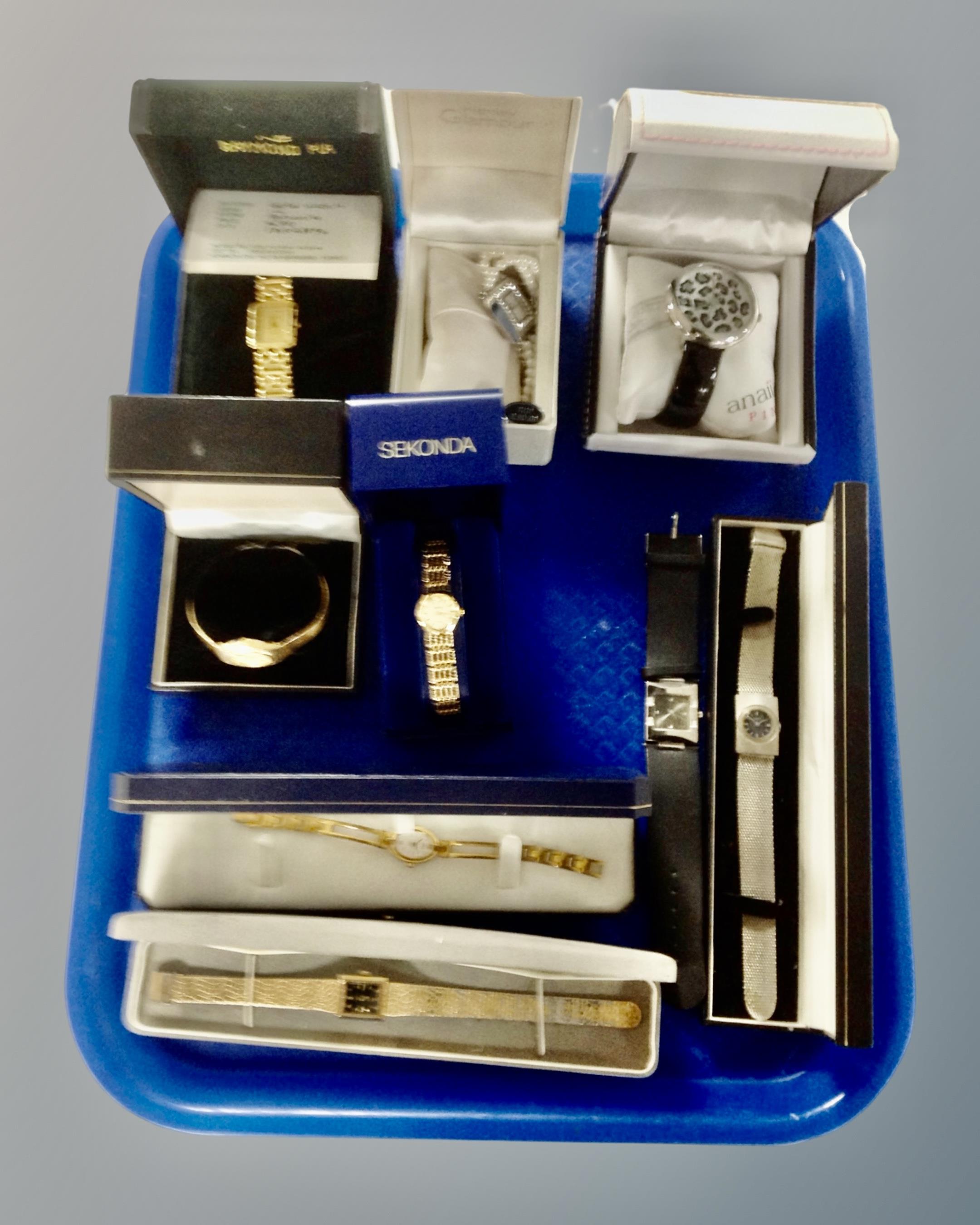 A tray containing a collection of boxed and unboxed lady's wristwatches including Timex, Sekonda,