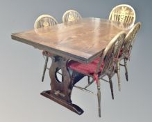 A good quality oak refectory extending dining table together with a set of five wheel back chairs,