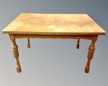 A 20th century Scandinavian dining table in an oak finish (length 130cm)