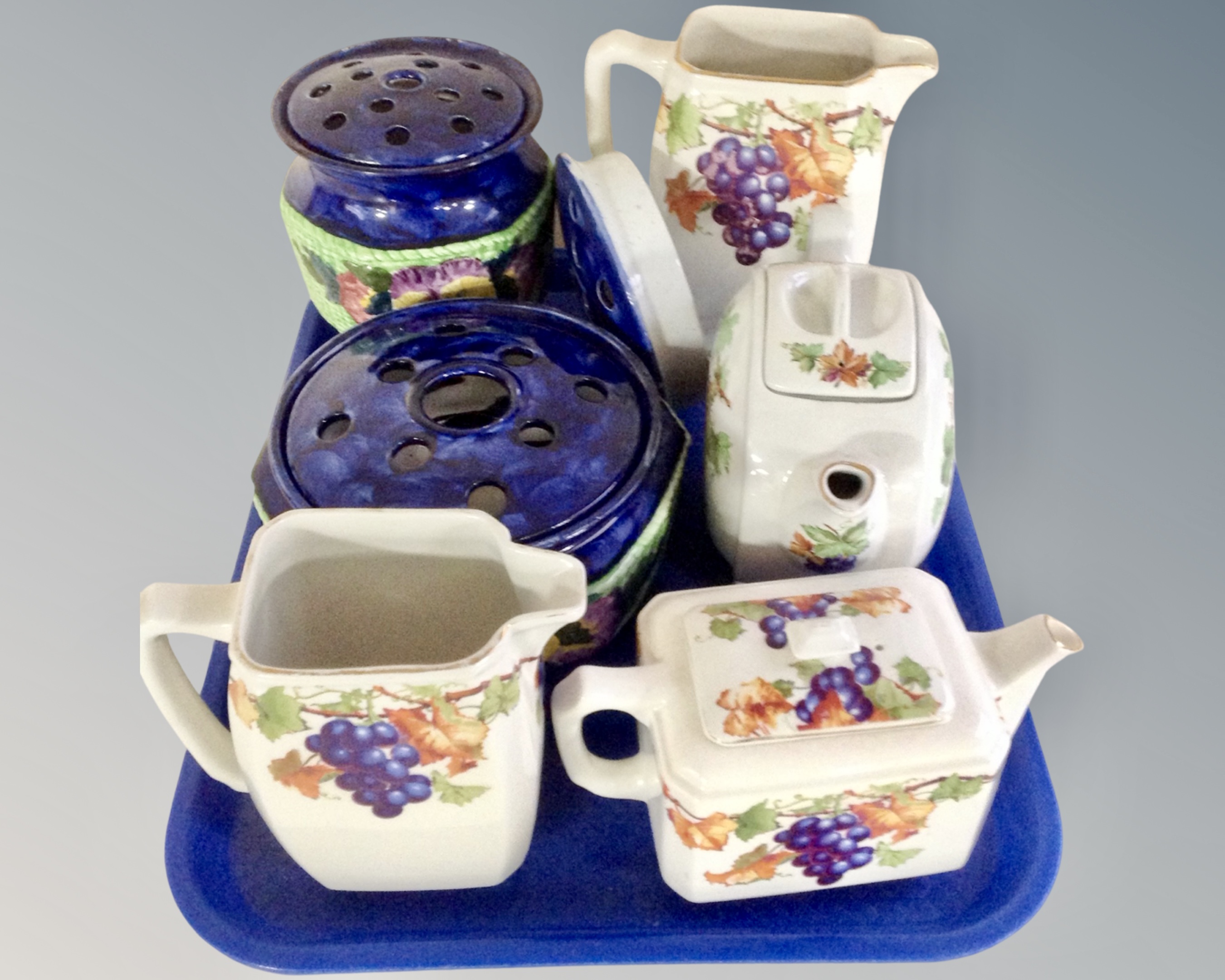 A tray containing a four piece Ringtons Maling teapot and jug set together with two Ringtons Maling