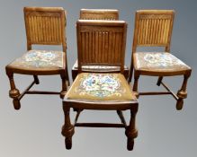 A set of four 1930s oak Art Deco panel back dining chairs.