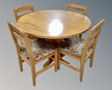 A late 20th century circular pedestal kitchen table (diameter 106cm) together with four chairs.