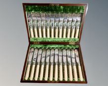 A canteen containing a 24 piece fish cutlery service with silver ferrules.