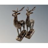 A pair of cast iron stag figures.