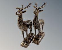 A pair of cast iron stag figures.