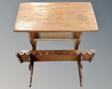 An oak refectory coffee table (length 68cm), together with a carved wall shelf.