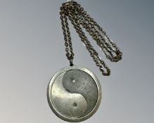 A Georg Jensen 'Yin and Yang' pewter pendant on chain.
