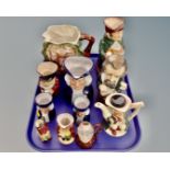 A tray containing 11 assorted character jugs including Beswick Sairey Gamp,