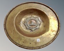 An early 20th century brass plate bearing Lincolnshire Regiment Egypt badge,