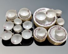 A collection of 77 pieces of Minton Carmine bone tea and dinner china.