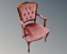 A beech salon armchair upholstered in pink dralon.