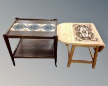 A 20th century Scandinavian two tier serving trolley with a tiled inset panel together with an oak
