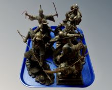A tray containing seven contemporary resin figures of Japanese samurai and warriors.