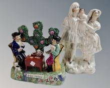Two Staffordshire figures, card game and family figure group.
