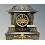 A Victorian black slate and brass-mounted 8-day mantel clock,