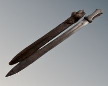 A Middle Eastern short sword in lizard skin scabbard,