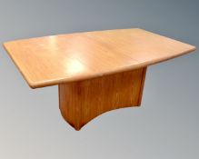 A Skovby extending pedestal dining table in a teak finish with internal leaf (length 245cm)