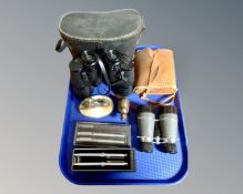 A tray containing two pairs of field glass including Prinz 7x50, Parker and Paper Mate pen sets,