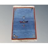 A small eastern pictorial woollen rug,