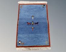 A small eastern pictorial woollen rug,