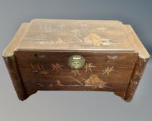 A 20th century carved camphor wood box (width 92cm)
