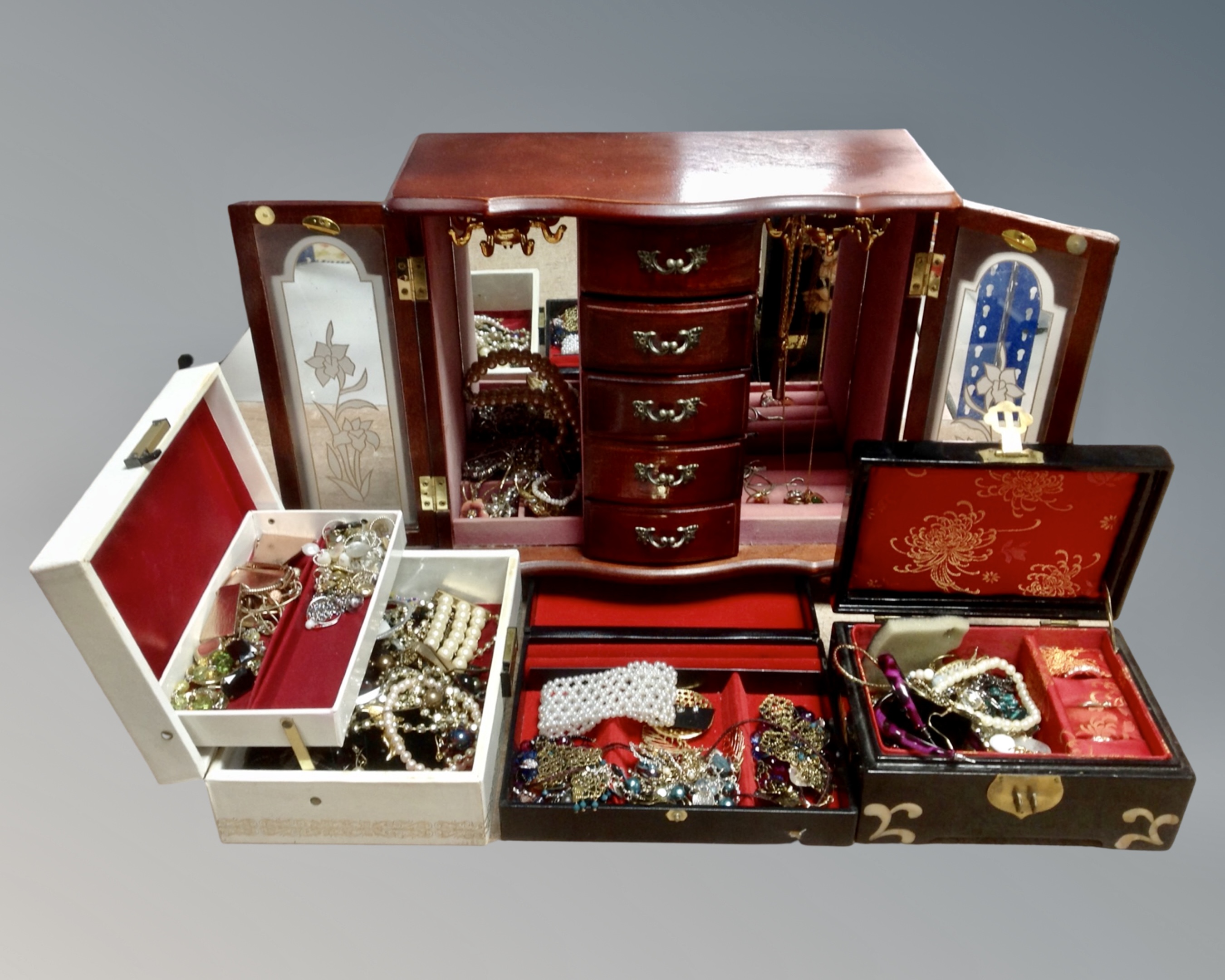 A tray containing three jewellery boxes and a cabinet containing a large quantity of assorted