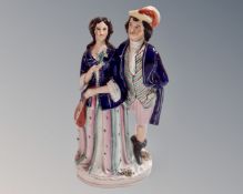 An antique Staffordshire figure of a Lady and Gentleman.