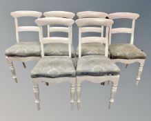 A set of six antique painted dining chairs.