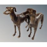 A pair of cast iron greyhound figures.