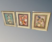 Three Far Eastern colour prints depicting figures, each 50cm by 63cm.