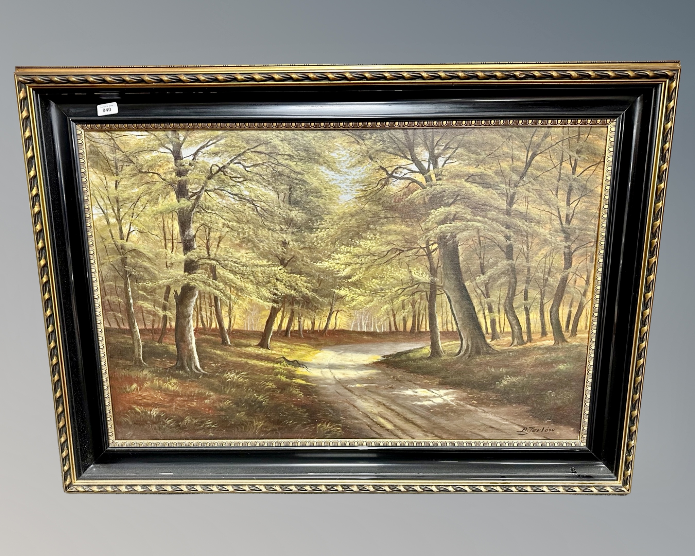A. Jerlow : A track leading through a forest, oil on canvas, 99cm by 64cm.