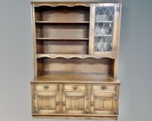 A Jaycee furniture wall/display unit fitted with cupboards and drawers beneath (width 144cm)