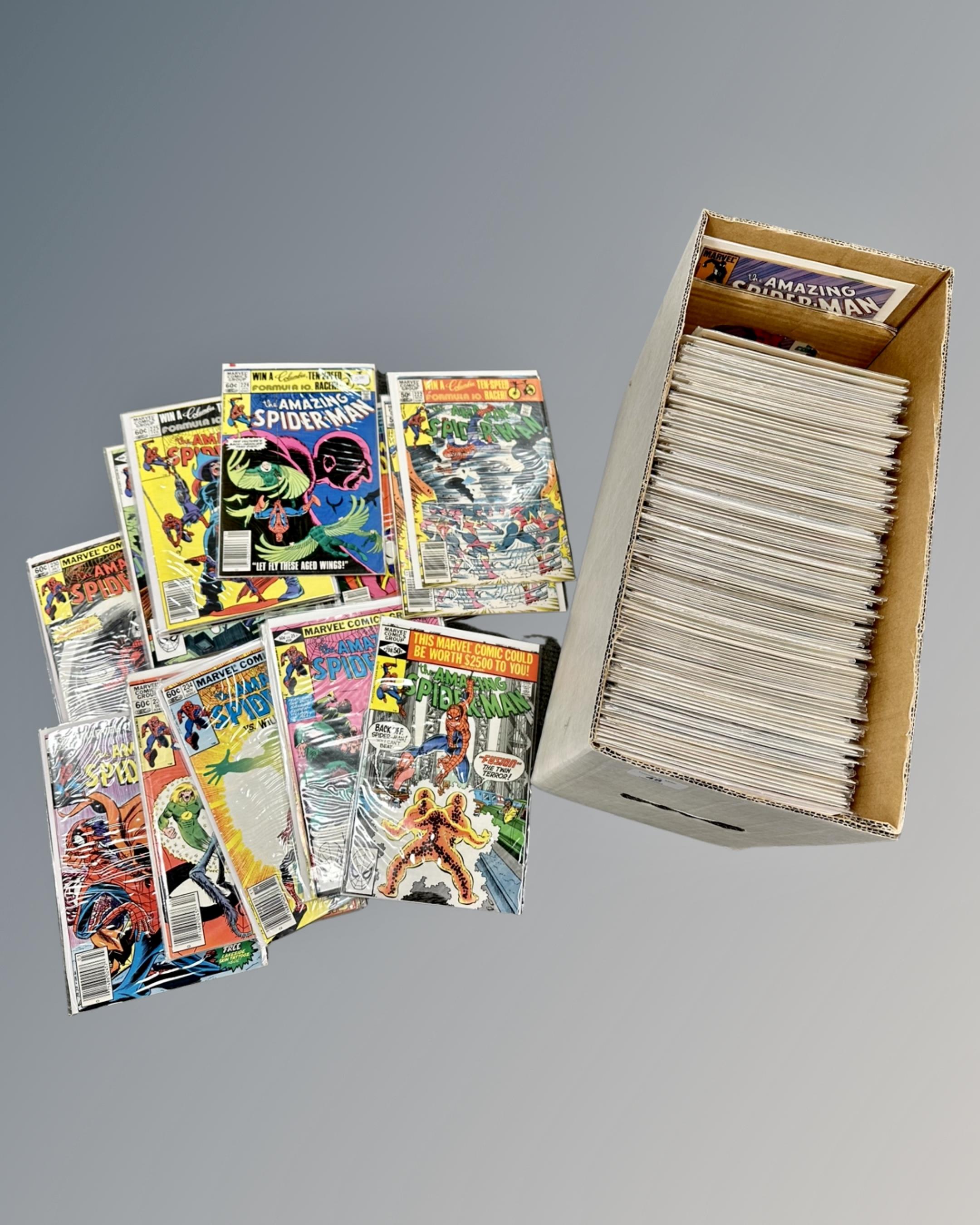 A box containing a large collection of Marvel's The Amazing Spider-Man comics.