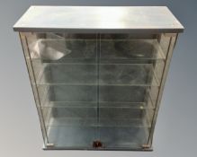 A contemporary glass double door curio cabinet.