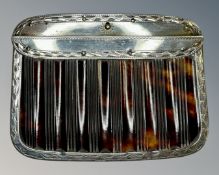 An antique silver and tortoiseshell purse.