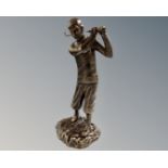 A cast iron figure of a golfer in bronzed finish