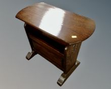 A Jaycee oak magazine table together with a stained beech wood standard lamp with shade depicting a