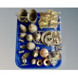 A tray containing assorted brass and copper wares including miniature candlesticks, trivets,