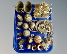 A tray containing assorted brass and copper wares including miniature candlesticks, trivets,