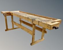A 20th century Scandinavian woodworking bench fitted with vices (length 250cm)