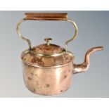 A 19th century copper and brass kettle.