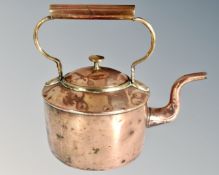 A 19th century copper and brass kettle.