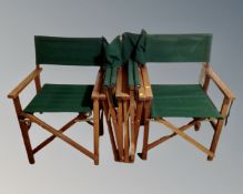 A set of four folding directors style armchairs.