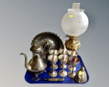 A tray containing a stainless steel bowl on stand, brass Buddha figure,