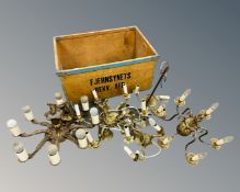 A crate containing five antique and later continental brass light fittings.