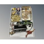 A tray containing miniature painted lead figures, a trench art lighter, whistle, scouting badges,