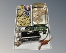 A tray containing miniature painted lead figures, a trench art lighter, whistle, scouting badges,