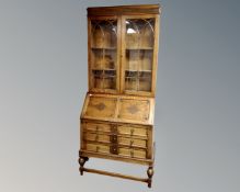 An Edwardian oak bureau bookcase (width 89cm)
